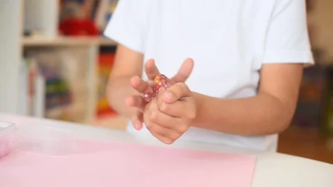 Child play with pink slime. playing with slime. Stock Footage