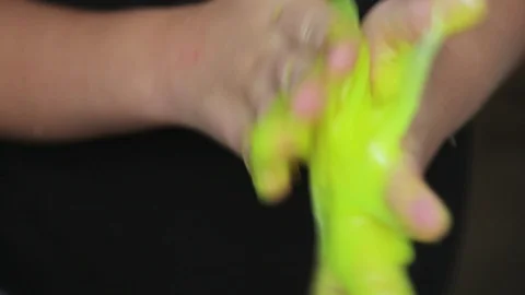 Child play with slime. playing with slime.hands and slime closeup Video stock 116724355