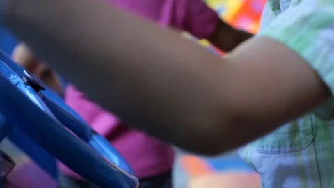 The child at the playground controls the machine Stock Footage 78845763