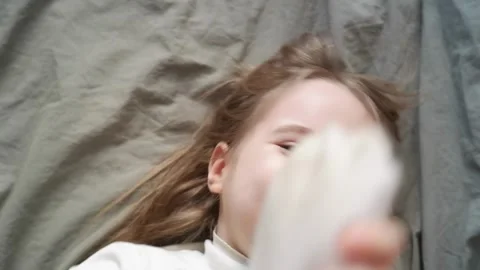 Child playing and making faces for the camera Stock Footage 303484807