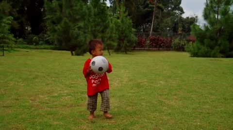 Child Playing Ball in The Park Stock Footage 10687612