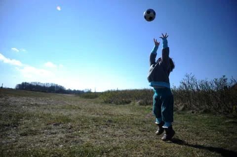 Child playing with ball Stock Photos