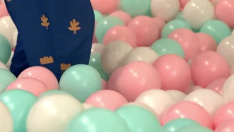 A child playing in a ballpit Stock Footage 245473071