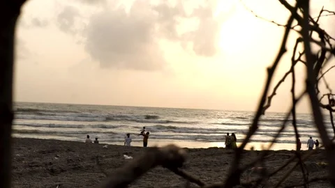 Child Playing on a Beach During Monsoon in Maharashtra, India Stock Footage 345640681