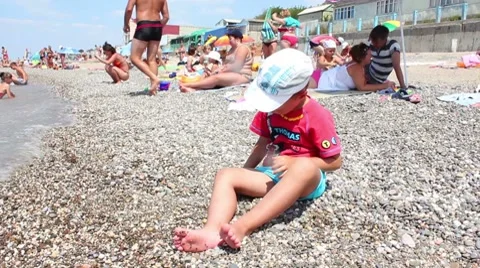 Child playing on beach Stock Footage 8533140