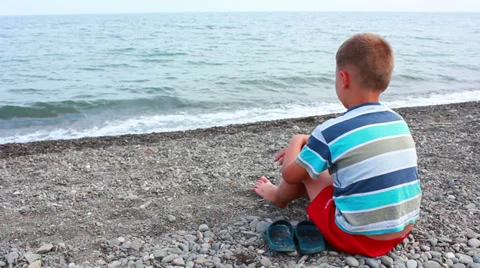 Child playing on beach Stock Footage 27265765
