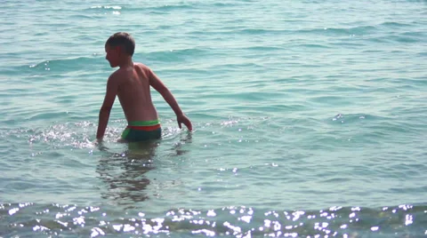 Child playing on beach Stock Footage 27266880