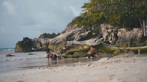 Child playing on the beach Stock Footage 73827707