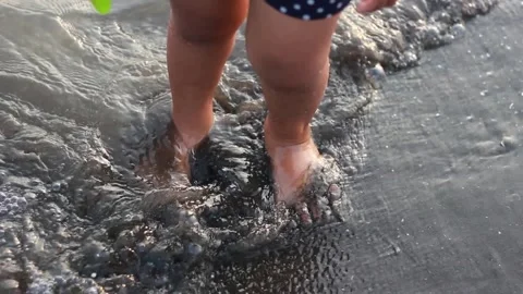 A child is playing on the beach Stock Footage 240901324