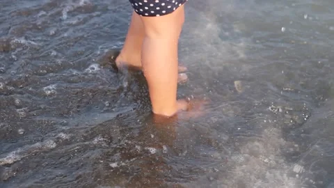 A child is playing on the beach Stock Footage 240901358