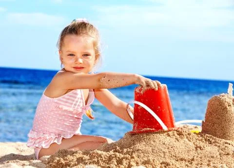 Child playing on  beach. Stock-Fotos
