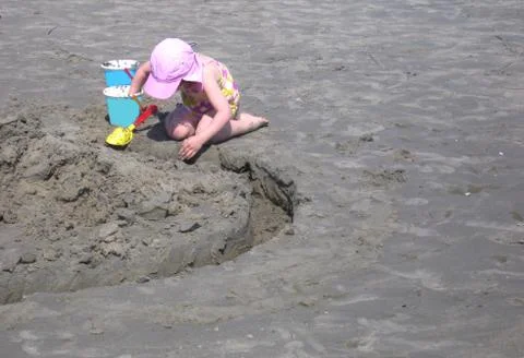 Child playing on beach Foto stock