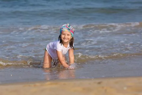 Child playing on the beach Stock Photos