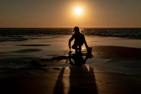 Child playing on the beach Stock Photos