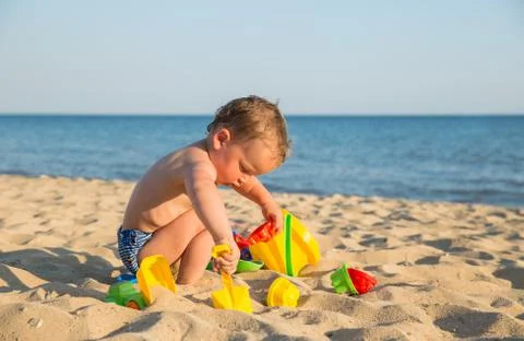 Child playing on the beach Stock Photos