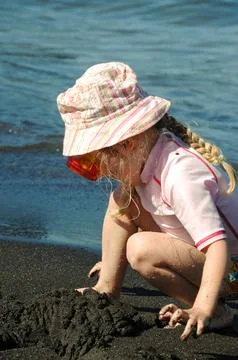 Child playing at the beach Stock Photos