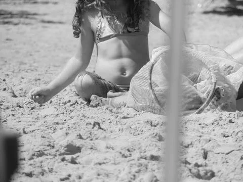 Child playing on the beach Stock Photos