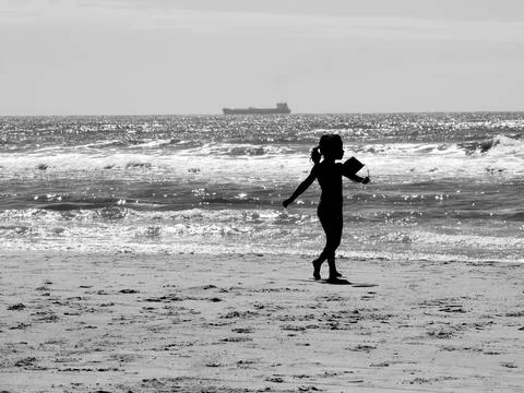Child playing on the beach Stock Photos