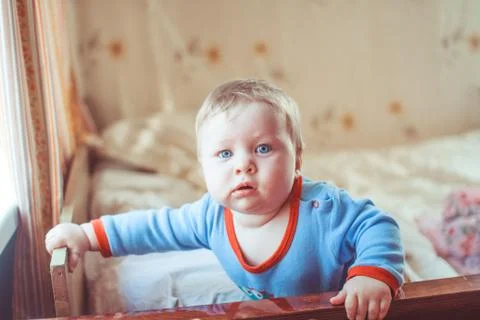 Child playing on bed Stock Photos