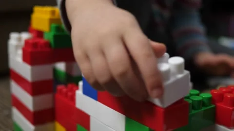 The child is playing with blocks Stock Footage 234458122