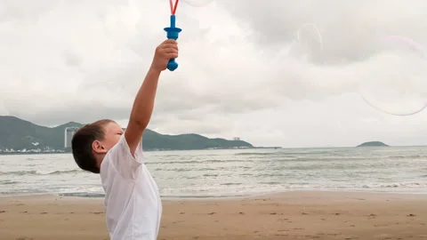 Child playing with bubble stick. Stock Footage 266783020