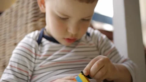 Child playing building blocks game Stock Footage 176429334