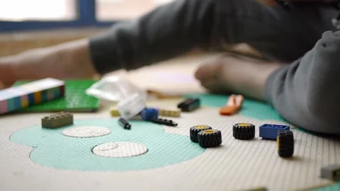 Child playing building blocks game Stock Footage 180127284