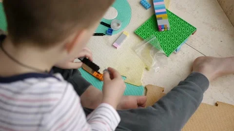 Child playing building blocks game Stock Footage 180127732