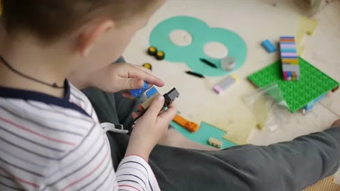 Child playing building blocks game Stock Footage 180128496