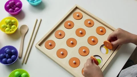 A child playing a children's educational game for the development of memory Stock Footage 161228646