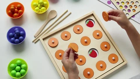A child playing a children's educational game for the development of memory Stock Footage 161228660