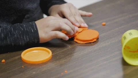Child playing with clay Stock Footage 232870207