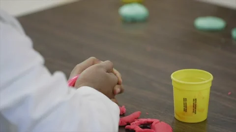 Child playing with clay Stock Footage 232870209