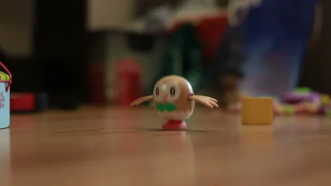 The child is playing with a clockwork toy 스톡 동영상 87177256