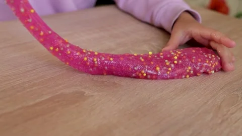 Child playing with colored slime close-up Stock Footage 221330103