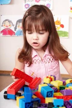 Child playing construction set in play room. Stock Photos