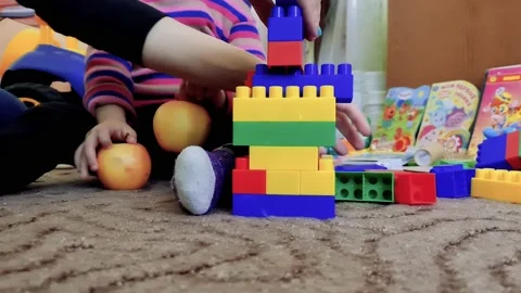 The child is playing constructor. Children's constructor game. Stock-Footage 160991512