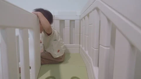 Child Playing in a Crib Stock Footage 341142743