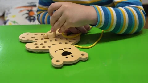 A child is playing with a development toy Stock Footage 130459502