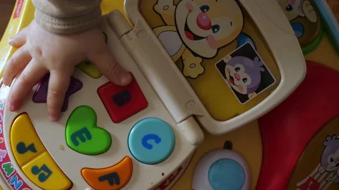 The child is playing with the educational activity table Stock Footage 154577326