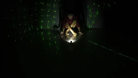 Child Playing with Flashlight in Dim Room Stock Footage 313467999