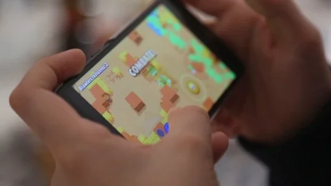 Child playing free app game in smartphone Stock Footage 123492446