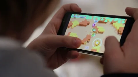 Child playing free app game in smartphone Stock Footage 123493625