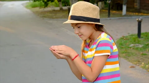 The child is playing with the frog. Selective focus. Stock Footage 218805081