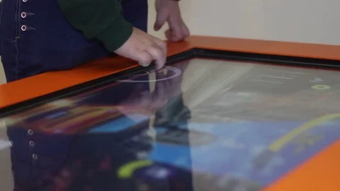 Child playing a game on the big touch table Stock Footage 81789844