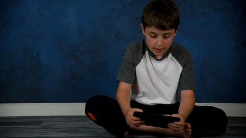 Child Playing Game on Technology Tablet Video stock 77348445