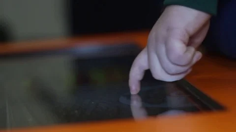 Child playing a game on the touch tablet Stock Footage 81789917