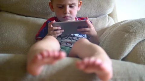 Child playing games on the smartphone Stock-Footage 80268185