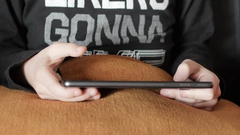 Child  playing games on tablet. Stock Footage 86061436