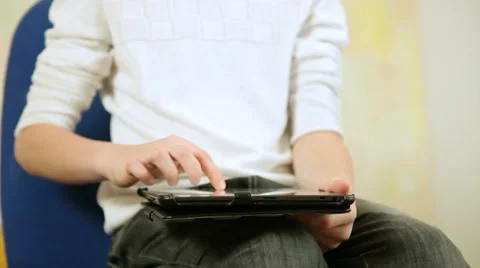 Child playing  games using tablet computer at home Stock Footage 45978803